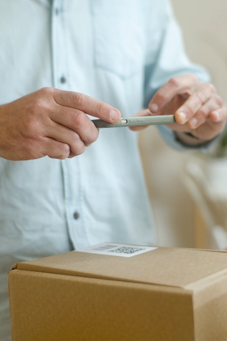 Man Taking Photo of the Package