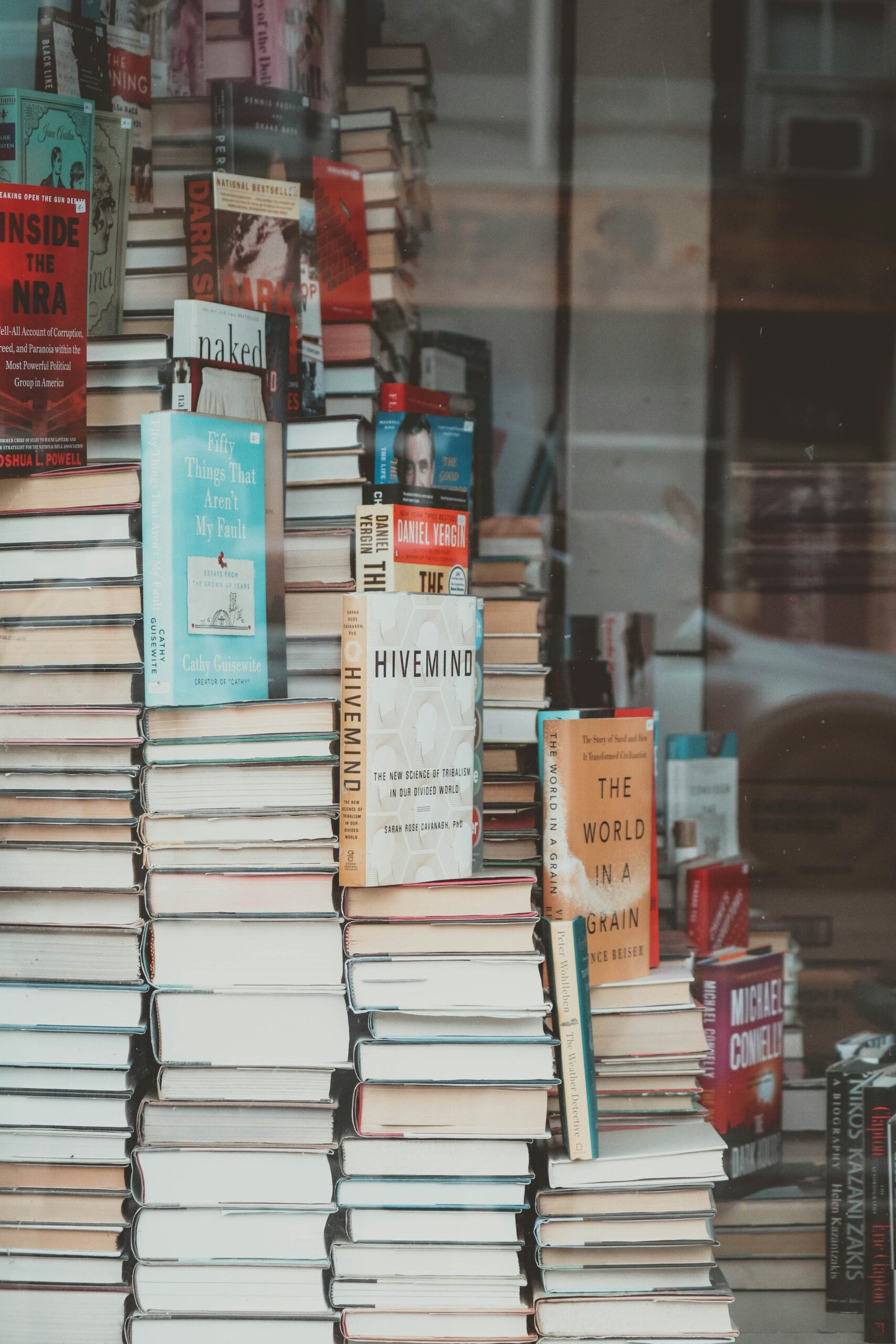 a stack of books sitting on top of a table